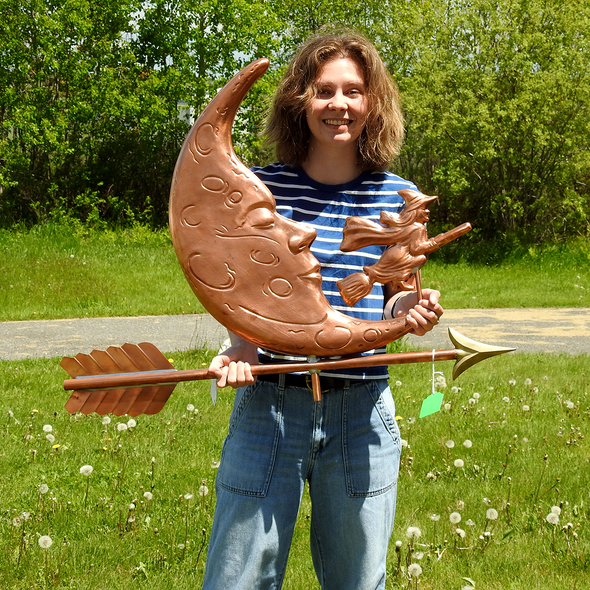 Riley holding Moon Weather Vane for Size Reference