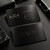 Bronze metal business card with warm metallic finish and engraved logo