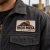 Close-up of a custom embroidered patch showing detailed thread stitching, raised texture, and a durable stitched border.