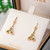 Solvar 14K Emerald Trinity Knot Drop Earrings S33500 ShamrockGift.com