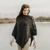 ML906 101 Charcoal Merino Irish Poncho with Button Detail Lifestyle Front ShamrockGift.com