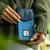 MCS-MAC2511- SKY BLUE Harris Tweed Scottish Phone Pouch LIFESTYLE FRONT VIEW ShamrockGift.com