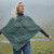 A200 403 CONNEMARA GREEN Colour Merino Wool Aran Poncho Cable Basket Stitches Lifestyle ShamrockGift.com A200 403 CONNEMARA GREEN Colour Merino Wool Aran Poncho Cable Basket Stitches Lifestyle ShamrockGift.com