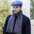 Mucros Weavers Kerry Herringbone Tweed Flat Cap Blue Color Lifestyle Front View ShamrockGift.com