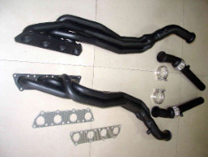 XS-POWER Audi B6 B7 S4 4.2L V8 Long Tube Headers and Downpipes with 2000°F Black Ceramic Heat Coating. Constructed from premium 304 stainless steel tubing and heavy-duty 12mm thick 321 stainless steel flanges for improved exhaust flow, reduced underhood temperatures, increased durability, and aggressive V8 performance.