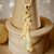 Elegant yellow beryl pendant necklace with vintage-inspired floral gold design and a luminous pearl accent.