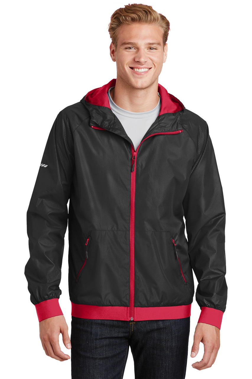 Sport-Tek® Embossed Hooded Wind Jacket. JST53 Black/ True Red