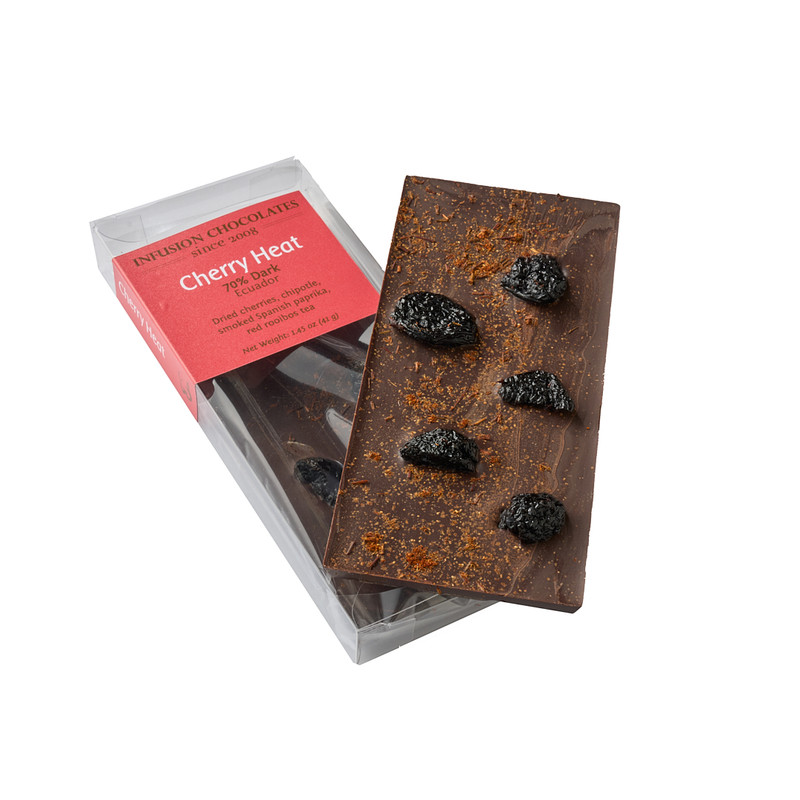 Made with fair direct, sustainable cacao. Get fired up with our Cherry Heat bar. 64% dark chocolate from the Sambirano region of Madagascar is topped with paprika, ancho and chipotle peppers, red rooibos tea and dried cherries.