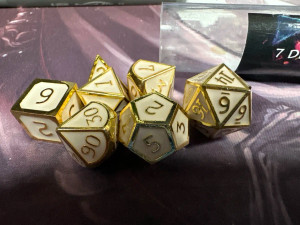 Assassin's Gold/White 7 Metal Polyhedral Dice Set Assassin's Gold/White 7 Metal Polyhedral Dice Set