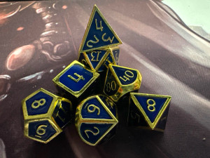 Assassin's Gold/Night Blue Metal 7 Polyhedral Dice Set Assassin's Gold/Night Blue Metal 7 Polyhedral Dice Set