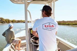 Proudly Made in the USA: Americana White T-Shirt | 50/50 Poly-Cotton Blend
Show your American pride in comfort and style with this classic white Americana t-shirt from Fish Lake Co. Crafted in the USA, this tee features a soft, breathable 50/50 poly-cotton blend that's perfect for everyday wear. Lightweight, durable, and designed for all-day comfort, it's ideal for patriotic events, holidays, or casual outings. Support American manufacturing with this high-quality, USA-made shirt that combines timeless style with homegrown craftsmanship. Proudly Made in the USA: Americana White T-Shirt | 50/50 Poly-Cotton Blend
Show your American pride in comfort and style with this classic white Americana t-shirt from Fish Lake Co. Crafted in the USA, this tee features a soft, breathable 50/50 poly-cotton blend that's perfect for everyday wear. Lightweight, durable, and designed for all-day comfort, it's ideal for patriotic events, holidays, or casual outings. Support American manufacturing with this high-quality, USA-made shirt that combines timeless style with homegrown craftsmanship.