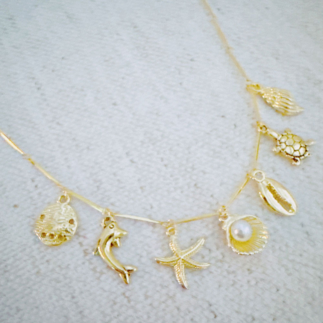 Golden Sea Charm Necklace – Shell, Dolphin & Starfish