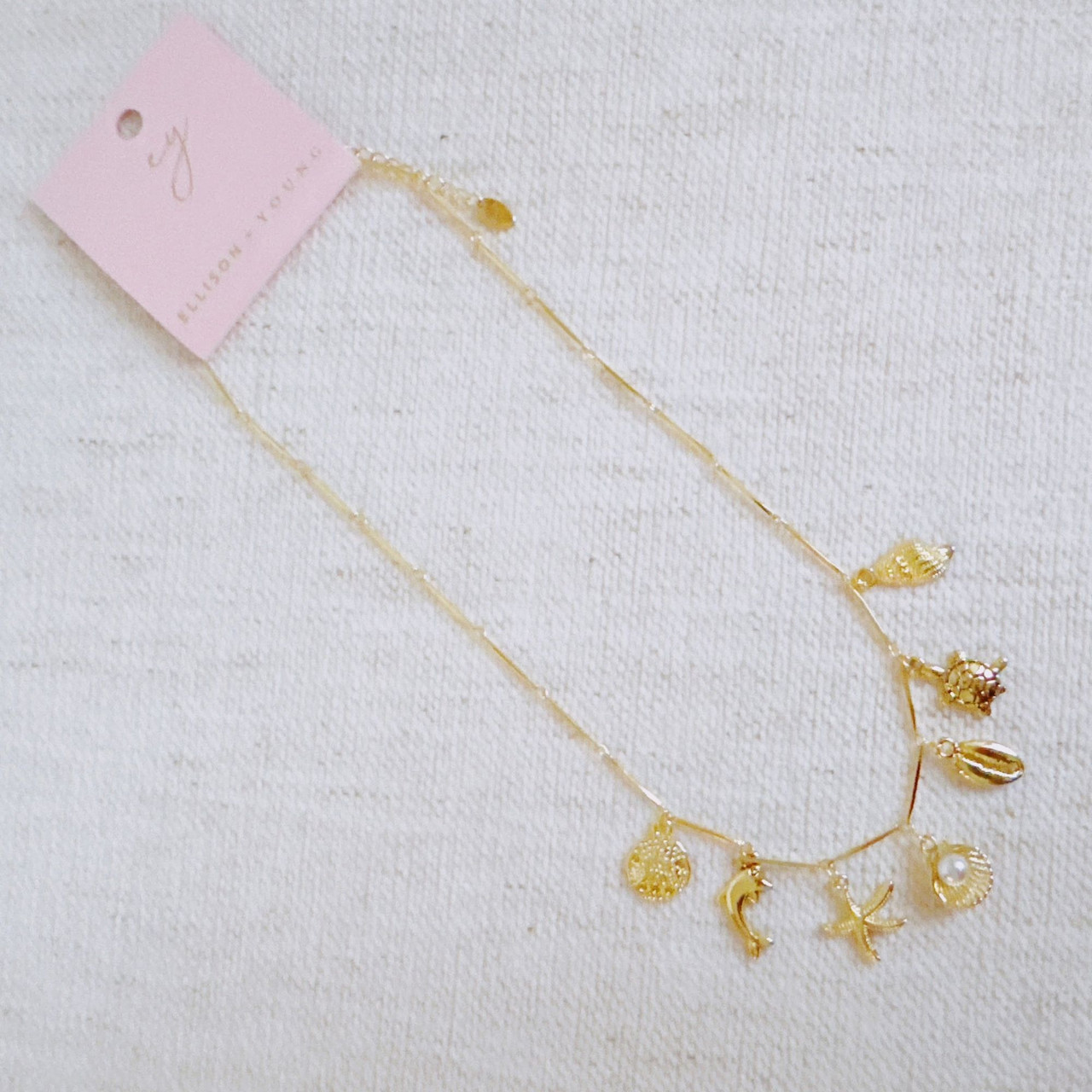 Golden Sea Charm Necklace – Shell, Dolphin & Starfish