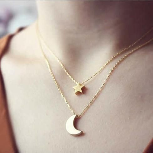 Golden Moon and Star Charms on a Layered Chain Necklace