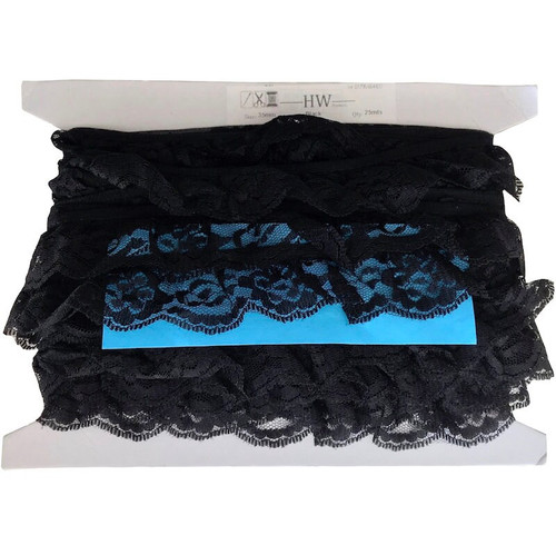 Image shows a bolt of black gathered/frilly lace that has a scalloped edge and a floral detail