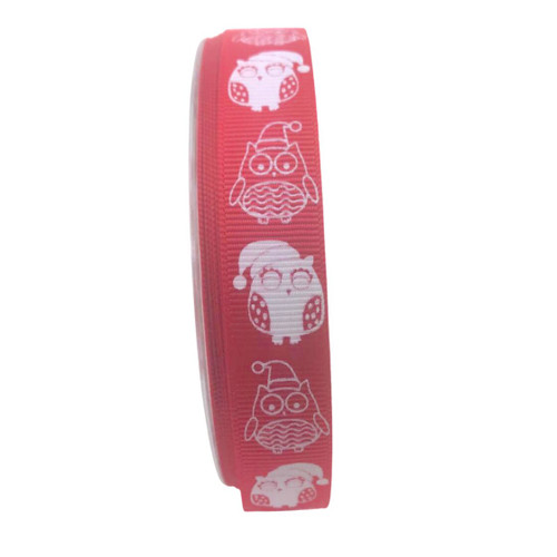 Image displays a reel of red, ribbed ribbon which has a print of cute owls in white, wearing a Santa hat.