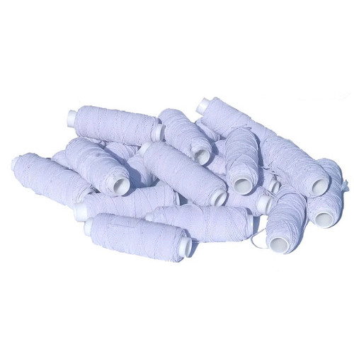 A group of spools of white shirring elastic