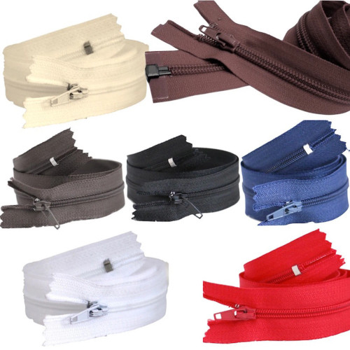 Image shows six colours of 18-inch (46cm) nylon open-end autolock zip with painted chain and pullers. Suitable for coats, jackets, luggage, and other garments needing a full opening zip.