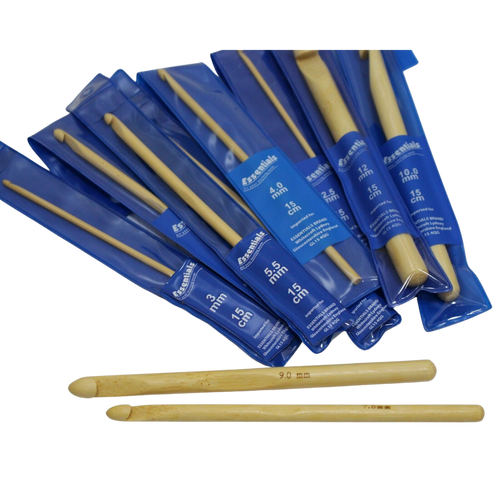 Image shows a selection of Whitecroft Essentials bamboo crochet hooks packaged in blue plastic sleeves.