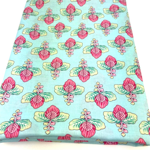 Image shows a medium weight light aqua cotton fabric, 137cm wide, printed with a colourful floral design featuring large flowers and leafy shapes resembling cabbage leaves. The design is uniform with no set direction. Folded in a rectangle.