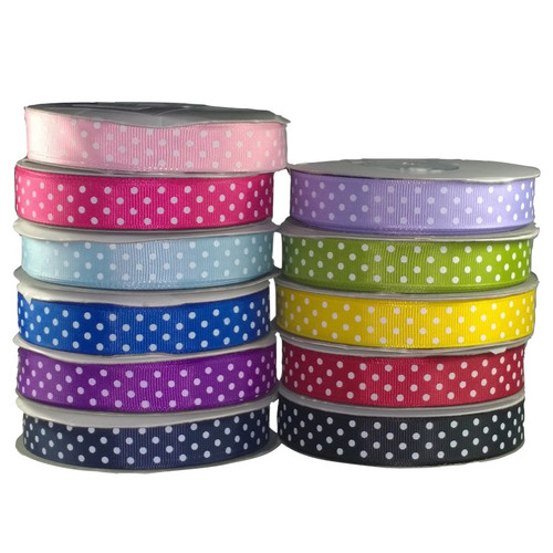 Image shows eleven 15mm-wide grosgrain ribbon with four rows of white printed polka dots on a ribbed background. Available by the metre or in 22.5m rolls, suitable for sewing, crafts, and gift wrapping.