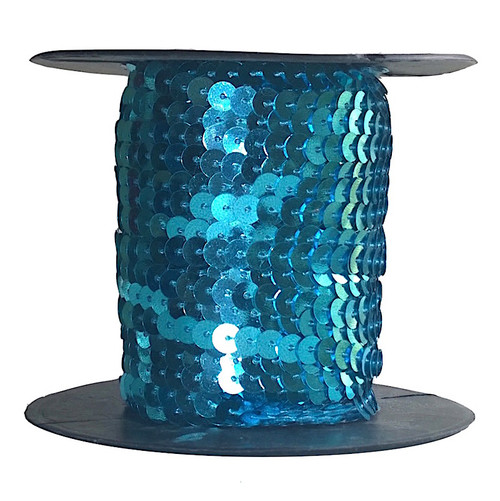 Aqua Blue hologram sequins each 6mm diameter, pre-strung on thread, shown on a roll.