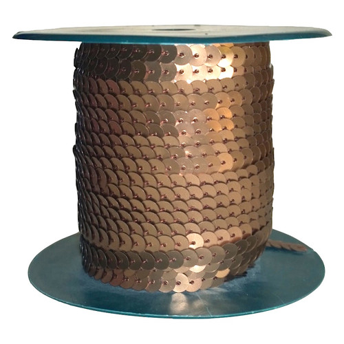 Copper Brown sequins each 6mm diameter, pre-strung on thread, shown on a roll.