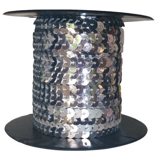 Silver sequins each 6mm diameter, pre-strung on thread, shown on a roll.