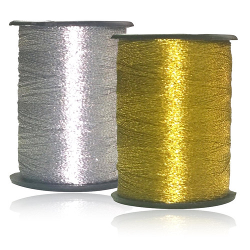 Reel of metallic silver and metallic gold nylon sewing thread on a black spool