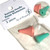 A close up photo of a pack of two rubber point protectors in two different sizes for knitting needles, they are inside a clear protective wallet. The make is Lesür