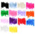 Image shows several colours of fluffy chandelle feather boa swatches. The feathers are real turkey feathers mixed with marabou strands, creating a full, lightweight, and textured appearance suitable for garment trimming.
