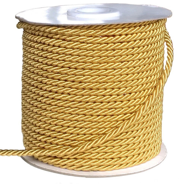 A reel of gold coloured twisted silk cord