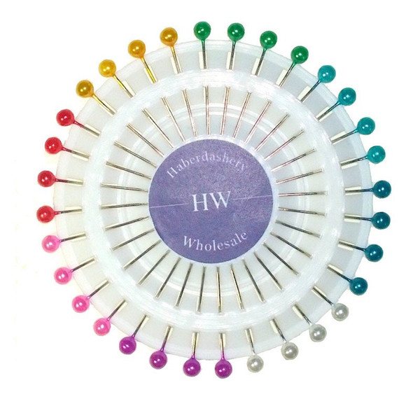 A single pin wheel containing pearl type headed pins the wheel has four each of the following coloured pins, pink, purple, white, light blue, dark blue, green, yellow, red. The centre of the pins states Haberdashery HW Wholesale