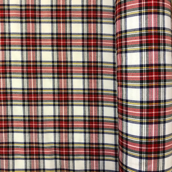 Image shows a length of Snowdon tartan polyester fabric, 150cm wide, in a medium-weight weave. The pattern features a classic tartan check in traditional colours with crisp, clean lines. The fabric has a smooth texture and moderate drape.