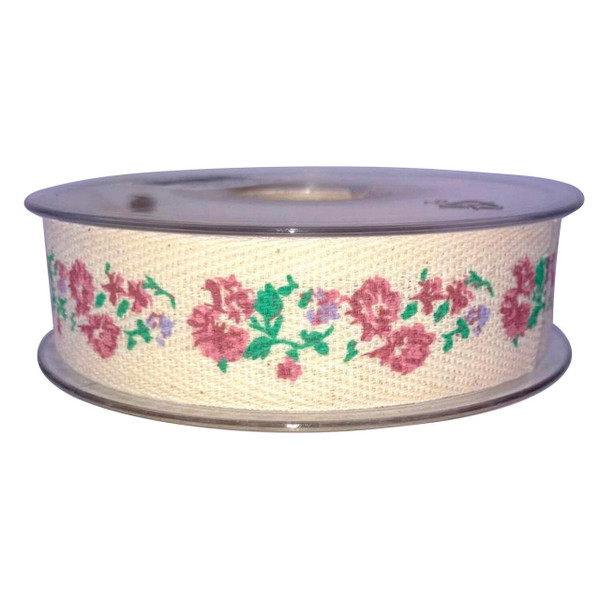 A real of cream coloured woven ribbon tape with a printed pattern of pink and lilac flowers and green leaves