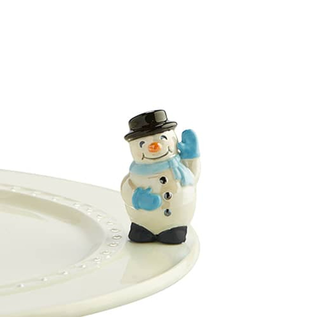 Nora Fleming, Frosty Pal  A172
This friendly snow pal will warm your heart on even the coldest winter’s day! Not dishwasher safe; hand wash only.
