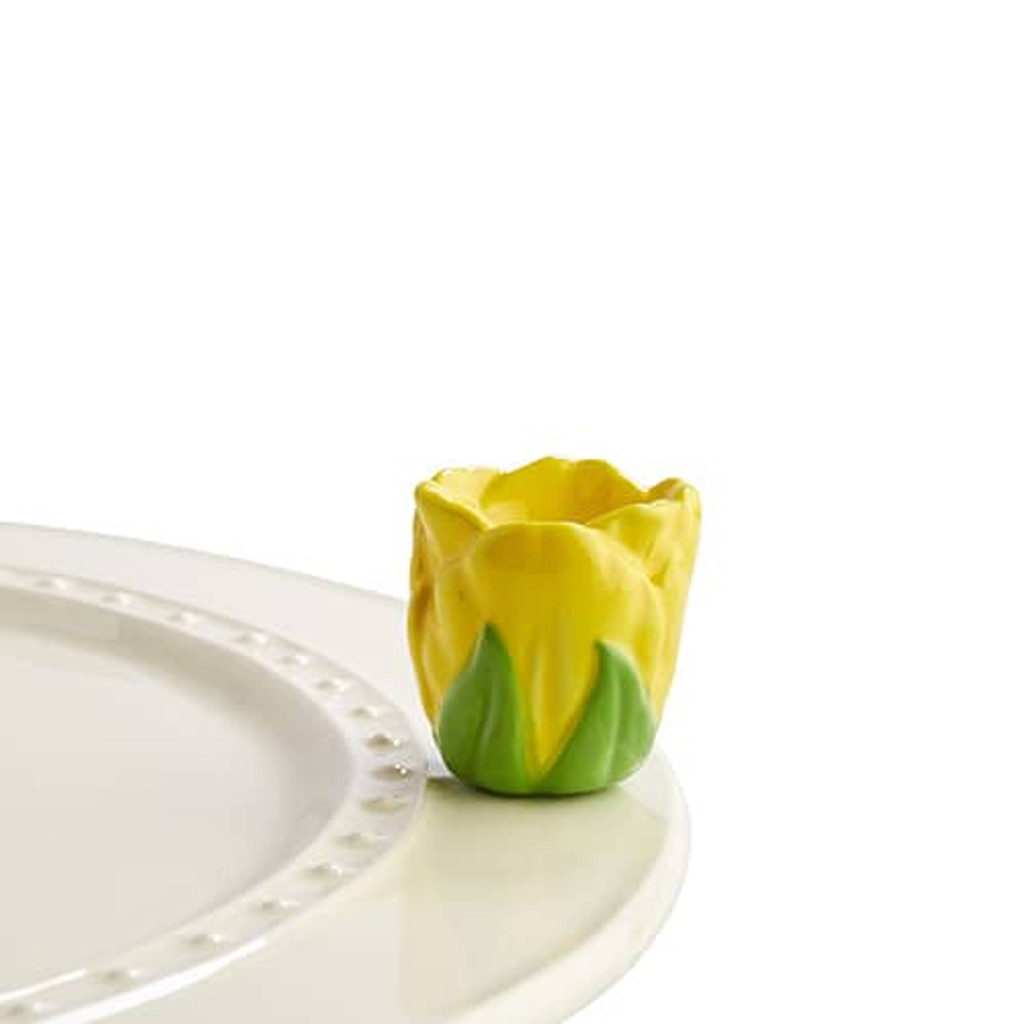 Nora Fleming tiptoe thru ’em A180
This bright and cheery yellow tulip will even hold toothpicks for your festive spring gathering!
 not dishwasher safe; hand wash only