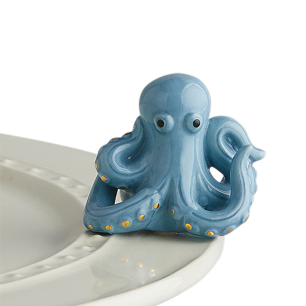 Nora Fleming under the sea A244
An octopus be elegant? ours is certainly trying! pair him with the starfish or mermaid tail for some nautical goodness!  
not dishwasher safe, hand wash only.