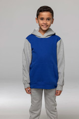 A child wearing a two-tone hoodie, featuring a blue torso and grey sleeves, with a front pocket.