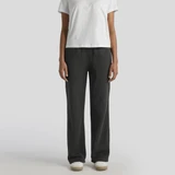 Cuffless track pants in a faded black colour, paired with a plain white t-shirt and casual footwear.