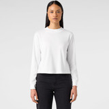 A white long-sleeve t-shirt with a round neck and minimalistic design. The model has straight black hair and is wearing dark jeans.