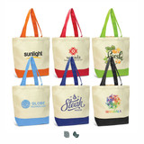 A collection of six canvas tote bags in various colours, featuring different logos and designs on a natural background.
