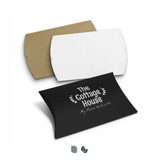 A set of extra-large pillow boxes in white, brown, and black colours, featuring a logo and decorative text. A set of extra-large pillow boxes in white, brown, and black colours, featuring a logo and decorative text.