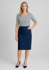 A woman wearing a navy lined skirt with a relaxed fit, paired with a striped top and heels.