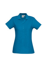 A blue ladies polo shirt featuring a collar and button placket, with a logo on the fabric.