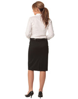 A black mid-length lined pencil skirt in poly/viscose stretch, paired with a white shirt and heels, viewed from the back. A black mid-length lined pencil skirt in poly/viscose stretch, paired with a white shirt and heels, viewed from the back.