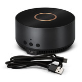 A wireless charging speaker in black with a gold accent, accompanied by a USB cable. A wireless charging speaker in black with a gold accent, accompanied by a USB cable.