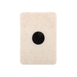 A creamy white magnetic clip with a circular black centre and a smooth, textured surface.