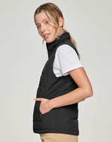 A black insulated puffer vest with a 3D cut, featuring a zip pocket and a sleek design.