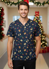 A navy unisex Christmas scrub top featuring festive patterns, worn by a smiling male model. Decorated with Christmas-themed illustrations.